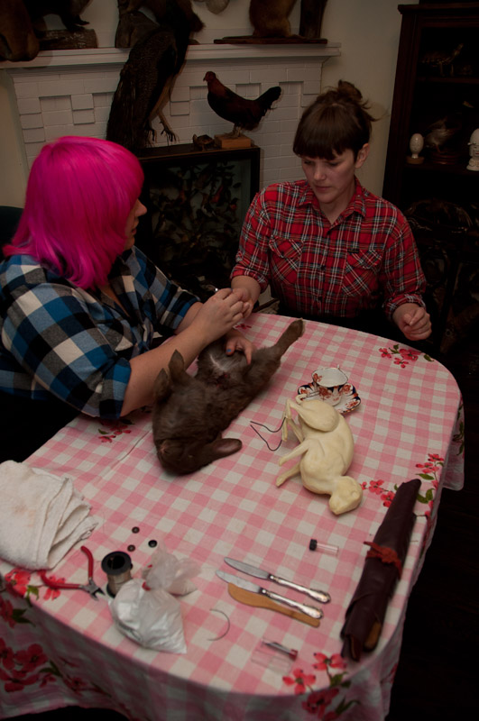 Morgan and Patti with a rabbit body on the table